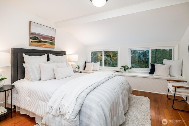 bedroom featuring vaulted ceiling and wood finished floors