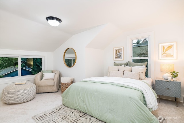 carpeted bedroom featuring vaulted ceiling