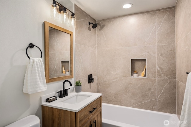 full bath featuring shower / bathing tub combination, toilet, and vanity