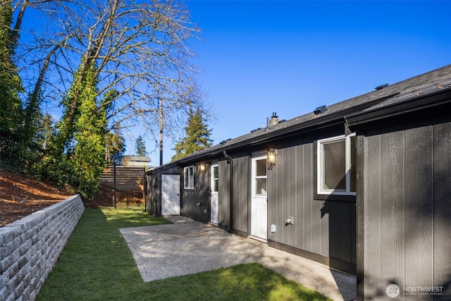 exterior space with fence and a patio area