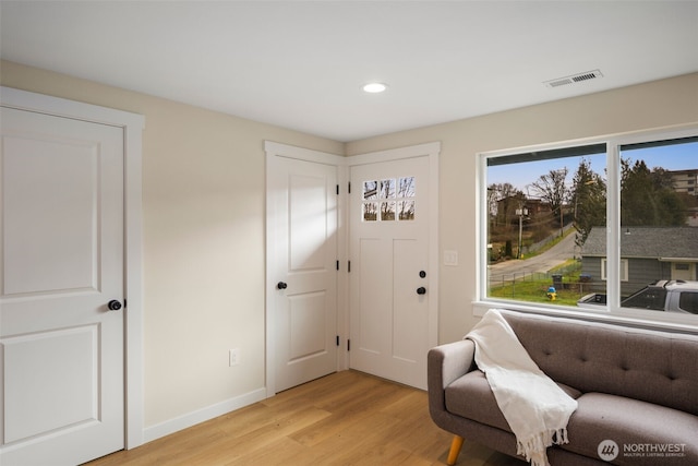 entryway featuring recessed lighting, light wood-style floors, visible vents, and baseboards