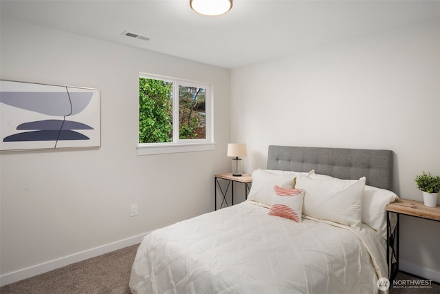 bedroom with baseboards, visible vents, and carpet floors