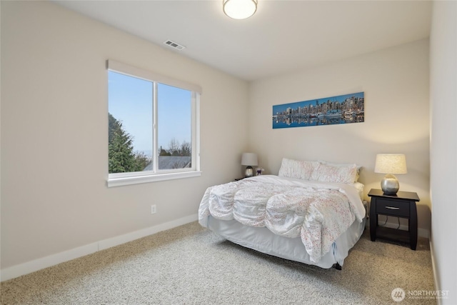 bedroom featuring visible vents, baseboards, and carpet flooring