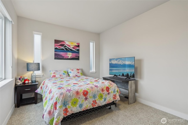 carpeted bedroom with baseboards