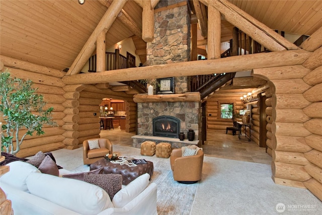 living area with wood finished floors, wood ceiling, arched walkways, and high vaulted ceiling