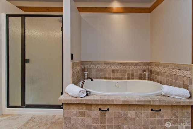 full bathroom with a garden tub, a stall shower, and tile patterned flooring