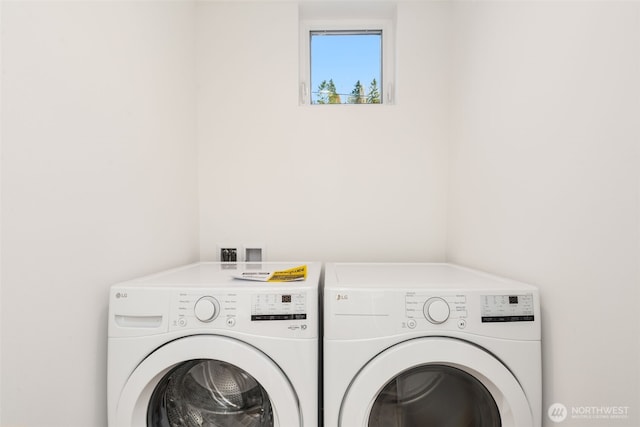 washroom with laundry area and washer and dryer