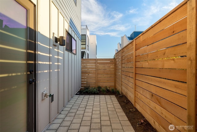 view of patio / terrace featuring fence