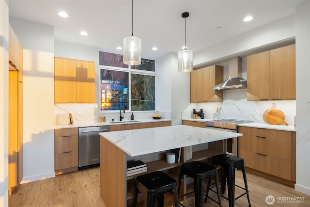 3833 59th Ave SW, Seattle, WA 98116 - kitchen featuring stainless steel appliances, a sink, wall chimney exhaust hood, modern cabinets, and recessed lighting