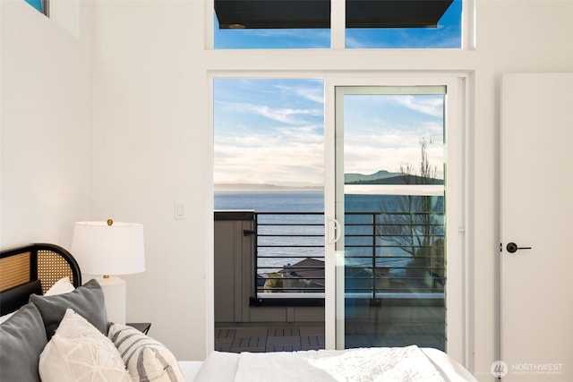 3833 59th Ave SW, Seattle, WA 98116 - bedroom featuring a water view and multiple windows