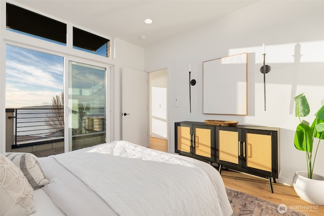 3833 59th Ave SW, Seattle, WA 98116 - bedroom with wood finished floors, access to outside, and recessed lighting