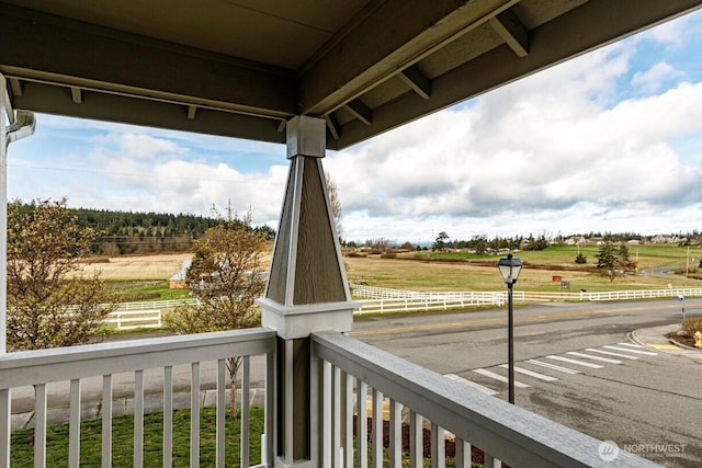 balcony featuring a rural view