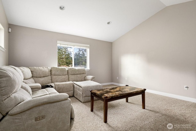 living room with lofted ceiling, baseboards, and light carpet