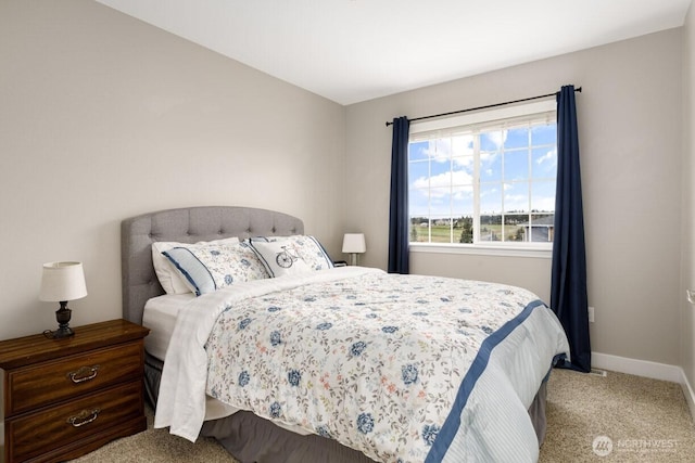 carpeted bedroom with baseboards