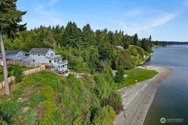 aerial view with a forest view and a water view