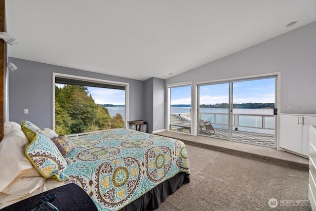 carpeted bedroom featuring lofted ceiling, access to exterior, and a water view