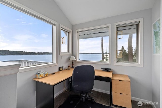 home office with vaulted ceiling, baseboards, and a water view