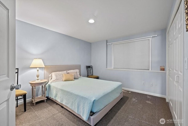 bedroom featuring baseboards and carpet floors