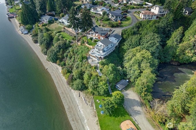 drone / aerial view with a residential view and a water view