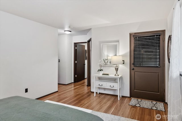 bedroom with wood finished floors