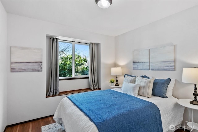 bedroom featuring wood finished floors