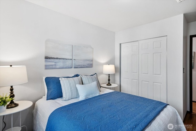 bedroom featuring a closet and wood finished floors