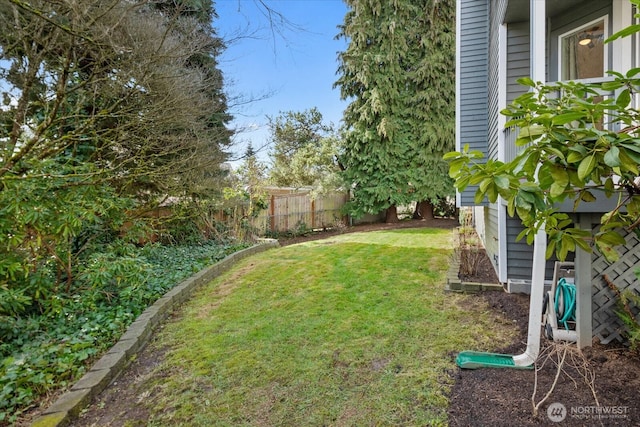 view of yard featuring a fenced backyard