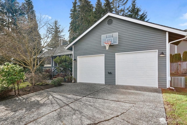 garage with concrete driveway