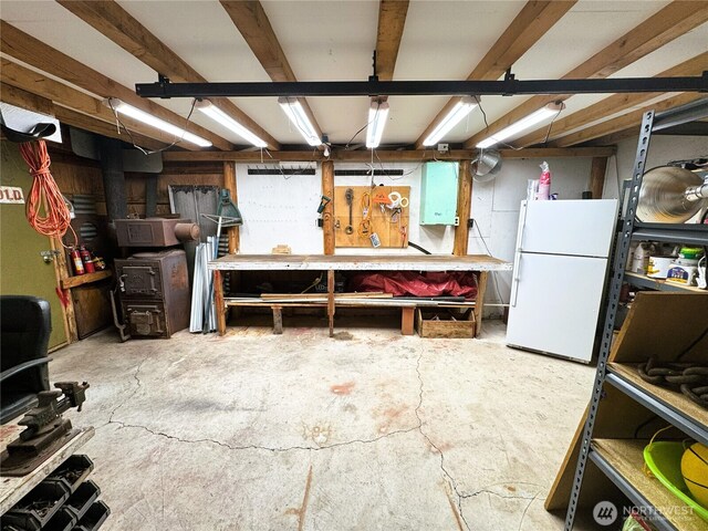 2254 Riffle Dr, Leavenworth, WA 98826 - below grade area featuring a workshop area and freestanding refrigerator