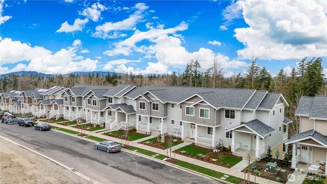 birds eye view of property with a residential view and a mountain view