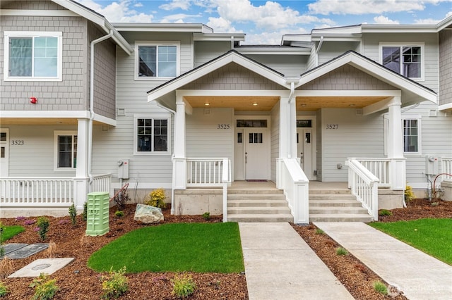 townhome / multi-family property with covered porch