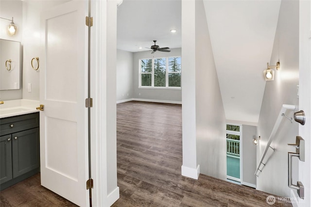 bathroom featuring vanity, wood finished floors, a ceiling fan, baseboards, and recessed lighting