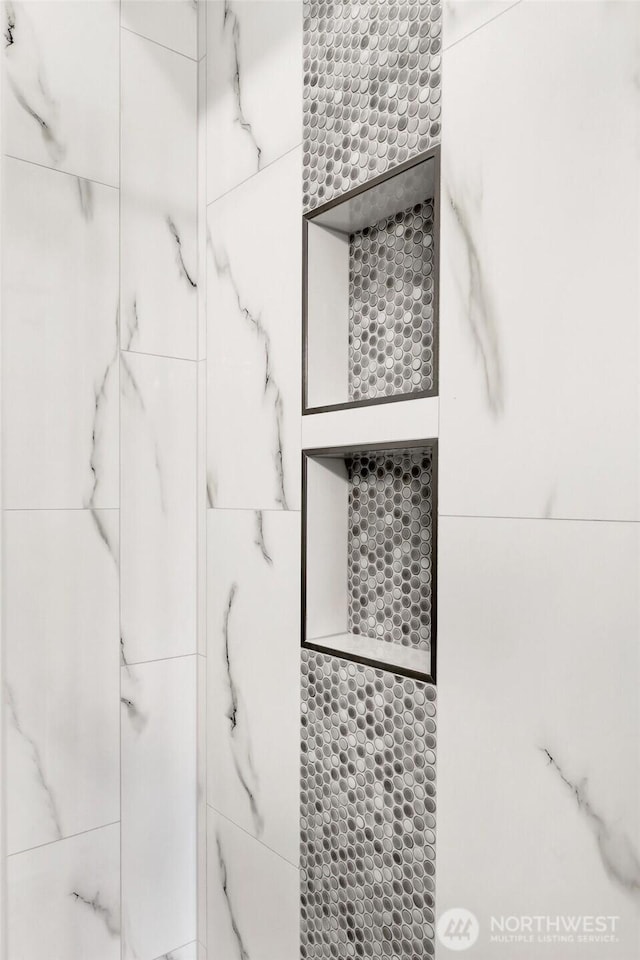 interior space featuring a tile shower