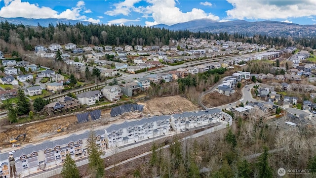 aerial view featuring a mountain view and a residential view