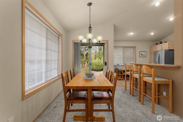 dining room featuring vaulted ceiling, a notable chandelier, recessed lighting, and visible vents