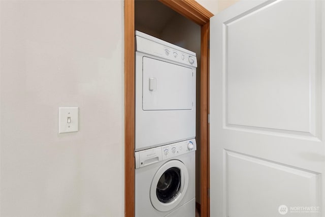 laundry room with laundry area and stacked washing maching and dryer