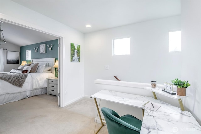 bedroom featuring light carpet and baseboards