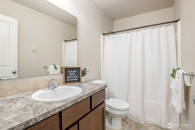 full bath featuring vanity and toilet