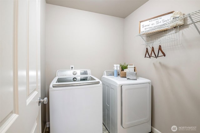 laundry area featuring laundry area and washer and clothes dryer