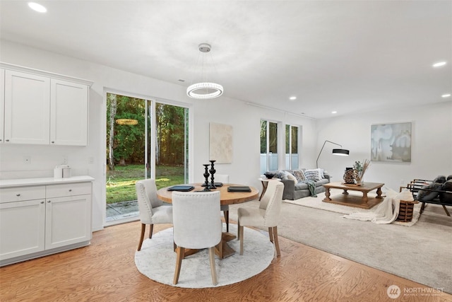 dining room featuring a wealth of natural light, recessed lighting, and light wood-type flooring