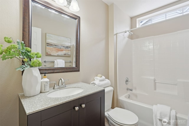 full bath with tub / shower combination, toilet, and vanity