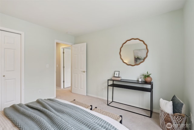 carpeted bedroom featuring baseboards