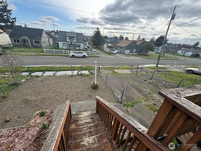 view of yard featuring a residential view and fence