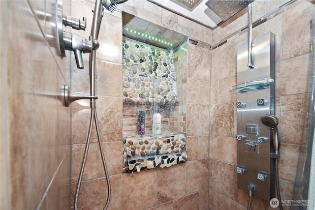 full bathroom featuring tiled shower