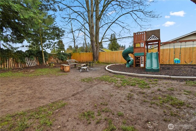 view of jungle gym featuring fence