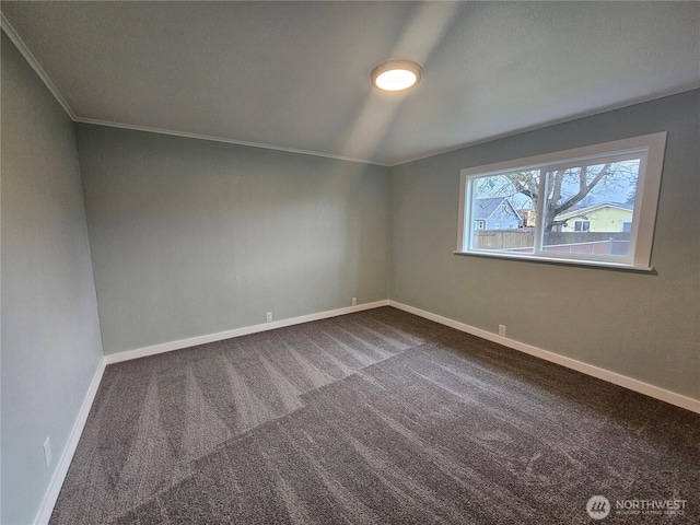 unfurnished room with baseboards, carpet floors, and ornamental molding