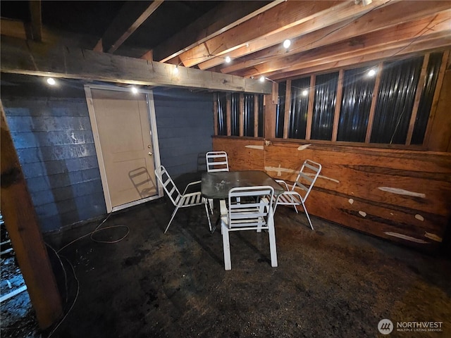 finished basement featuring concrete block wall