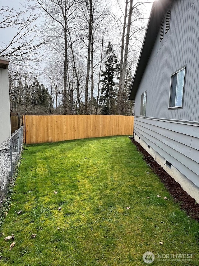 view of yard with a fenced backyard