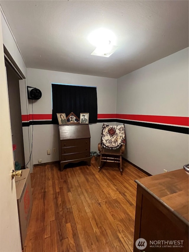 bedroom featuring wood finished floors