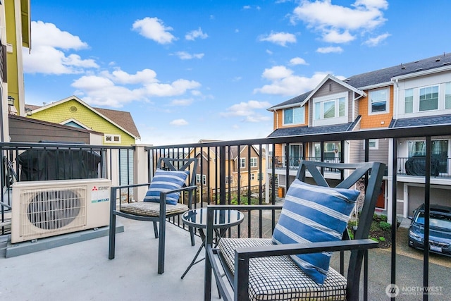 balcony with ac unit and a residential view